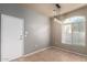 Neutral-toned dining room featuring tile floors and a door at 2150 W Alameda Rd # 1273, Phoenix, AZ 85085