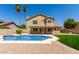 Inviting swimming pool with a spacious backyard and a view of the house at 5725 E Evans Dr, Scottsdale, AZ 85254