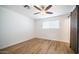 Bright bedroom with ceiling fan and wood-look floors at 1642 W Capri Ave, Mesa, AZ 85202