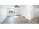 Light and airy living room with hardwood floors and a view to the front yard at 1642 W Capri Ave, Mesa, AZ 85202
