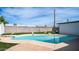 Inviting kidney-shaped pool with diving board at 1642 W Capri Ave, Mesa, AZ 85202