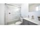 Updated bathroom with a walk-in shower and gray vanity at 1642 W Capri Ave, Mesa, AZ 85202