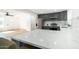 Modern kitchen with island, dark gray cabinets and stainless steel appliances at 1642 W Capri Ave, Mesa, AZ 85202