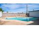 Inviting kidney-shaped pool with diving board at 1642 W Capri Ave, Mesa, AZ 85202