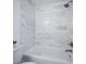 Clean bathroom with white marble tile and a shower/tub combo at 1642 W Capri Ave, Mesa, AZ 85202