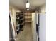 Unfinished basement area with shelving for storage at 1642 W Capri Ave, Mesa, AZ 85202