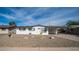 Charming ranch-style home with a freshly painted exterior and rock landscaping at 1642 W Capri Ave, Mesa, AZ 85202