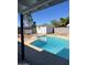 Inviting kidney-shaped pool with diving board at 1642 W Capri Ave, Mesa, AZ 85202