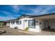 Charming single-story home with white exterior and landscaped front yard at 1642 W Capri Ave, Mesa, AZ 85202