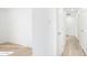 Clean and bright hallway with light wood-look floors at 1642 W Capri Ave, Mesa, AZ 85202