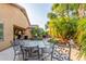 Relaxing backyard patio with seating area and lush landscaping at 2260 W Mineral Butte Dr, San Tan Valley, AZ 85144