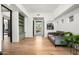 Light and airy hallway with built-in shelving, daybed and access to patio at 10184 E Peak Cir, Scottsdale, AZ 85262