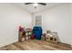Playroom with ' toys, play kitchen, and shelving unit at 20442 E Rosa Rd, Queen Creek, AZ 85142