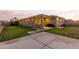 Spacious backyard with string lights, grass, and a patio area at 20442 E Rosa Rd, Queen Creek, AZ 85142