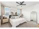 Spacious main bedroom with a large bed, ensuite bathroom, and plenty of natural light at 20442 E Rosa Rd, Queen Creek, AZ 85142