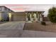 Charming curb appeal with a two-car garage and well-maintained landscaping at 20442 E Rosa Rd, Queen Creek, AZ 85142