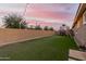 Landscaped backyard with a trampoline and basketball hoop at 20442 E Rosa Rd, Queen Creek, AZ 85142