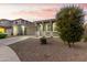 Beautiful single-story home with a two-car garage and landscaped front yard at 20442 E Rosa Rd, Queen Creek, AZ 85142