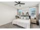 Spacious primary bedroom with large bed, nightstands, and decorative wall art at 20442 E Rosa Rd, Queen Creek, AZ 85142