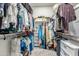 Large walk-in closet with ample hanging space and shelving at 20442 E Rosa Rd, Queen Creek, AZ 85142