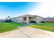 Spacious backyard with grassy area and covered patio at 20442 E Rosa Rd, Queen Creek, AZ 85142