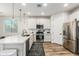 Modern kitchen featuring white shaker cabinets and stainless steel appliances at 20442 E Rosa Rd, Queen Creek, AZ 85142