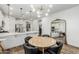 Light and bright dining area with round table and modern chandelier at 20442 E Rosa Rd, Queen Creek, AZ 85142