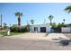 Modern single-story home with a landscaped front yard and two-car garage at 519 E El Camino Dr, Phoenix, AZ 85020