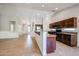 Kitchen with island, dark wood cabinets, and tile flooring at 2448 E Fiesta Dr, Casa Grande, AZ 85194