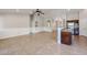 Open living area with high ceilings, tile floors and kitchen island at 2448 E Fiesta Dr, Casa Grande, AZ 85194