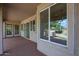 Covered patio with multiple windows and sliding glass doors at 2448 E Fiesta Dr, Casa Grande, AZ 85194
