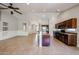Open concept kitchen with island and views into living room at 2448 E Fiesta Dr, Casa Grande, AZ 85194