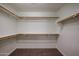 Large walk-in closet with double hanging rods and shelving at 2448 E Fiesta Dr, Casa Grande, AZ 85194