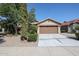 Single-story home with a two-car garage and landscaped front yard at 2448 E Fiesta Dr, Casa Grande, AZ 85194