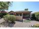 House's backyard with patio, landscaping, and stone fireplace at 2448 E Fiesta Dr, Casa Grande, AZ 85194