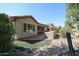 Home's backyard with patio, landscaping, and a partial view of the house at 2448 E Fiesta Dr, Casa Grande, AZ 85194