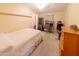Cozy bedroom with a double bed, built-in desk and dresser at 11596 W Sierra Dawn Blvd # 36, Surprise, AZ 85378