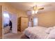 Spacious main bedroom with a king-size bed and walk-in closet at 11596 W Sierra Dawn Blvd # 36, Surprise, AZ 85378