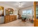 Spacious dining area with wood furniture and large window at 9821 N 103Rd Ave, Sun City, AZ 85351