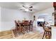 Bright dining room with hardwood floors, a wood table, and built-in cabinetry at 518 N Home Pl, Chandler, AZ 85224