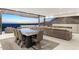 Modern dining area with glass table and chairs, offering stunning sunset views at 7201 N 23Rd Pl, Phoenix, AZ 85020