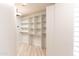 Large walk-in closet with ample shelving and hanging space at 30600 N Pima Rd # 58, Scottsdale, AZ 85266