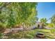 Relaxing backyard space with a fire pit and mature trees at 3731 E Equestrian Trl, Phoenix, AZ 85044