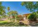 Landscaped backyard with a fire pit and lush greenery at 3731 E Equestrian Trl, Phoenix, AZ 85044