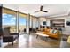Living room with city views and modern furniture at 207 W Clarendon Ave # 20B, Phoenix, AZ 85013