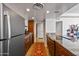 Kitchen with granite countertops and stainless steel appliances at 207 W Clarendon Ave # 20B, Phoenix, AZ 85013