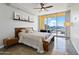 Main bedroom with city views, wood furniture, and ceiling fan at 207 W Clarendon Ave # 20B, Phoenix, AZ 85013