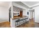 Open concept kitchen with granite countertops and bar seating at 207 W Clarendon Ave # 20B, Phoenix, AZ 85013