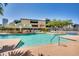 Expansive pool with building view and seating at 207 W Clarendon Ave # 20B, Phoenix, AZ 85013