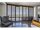 Living room with large windows and city views at 207 W Clarendon Ave # 20B, Phoenix, AZ 85013
